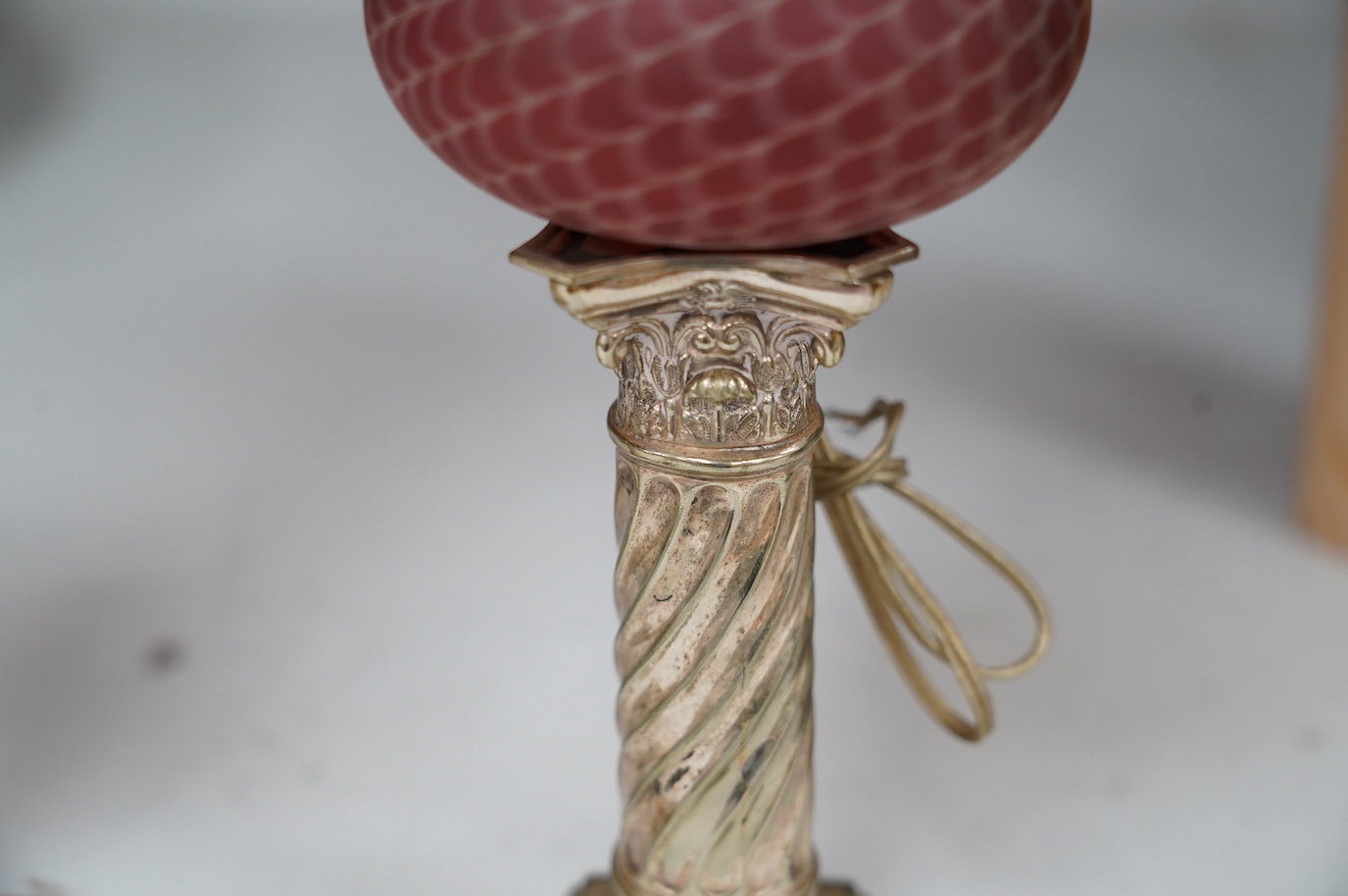 A pair of electroplate and ruby glass oil lamps, 35cm. Condition - good, not tested